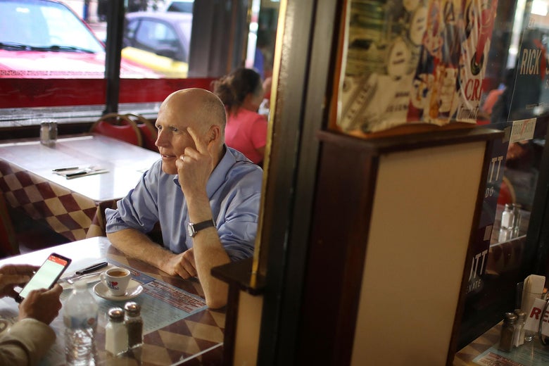 Florida Governor Rick Scott makes a campaign stop at a Cuban restaurant in June.